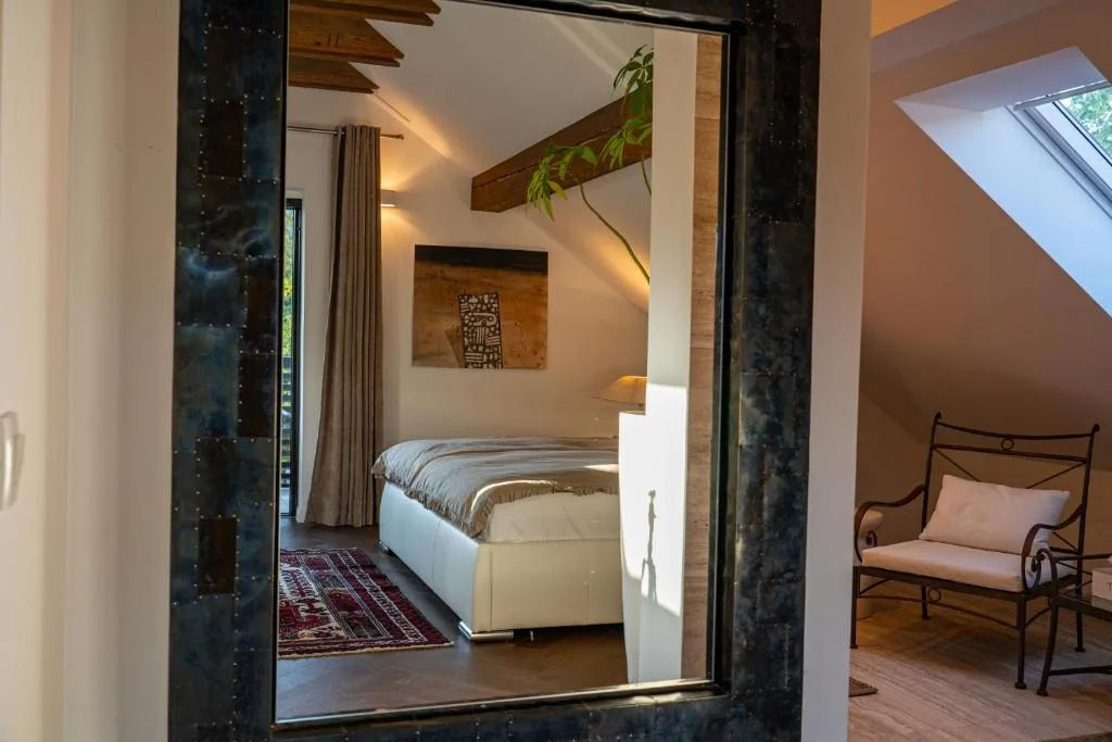 Private balcony with garden and hill views at Maxis Penthouse Bled