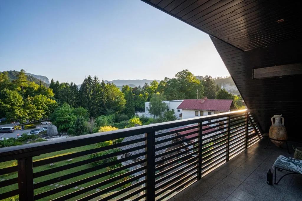Spacious penthouse living area with natural light and wooden floors at Maxis Penthouse Bled